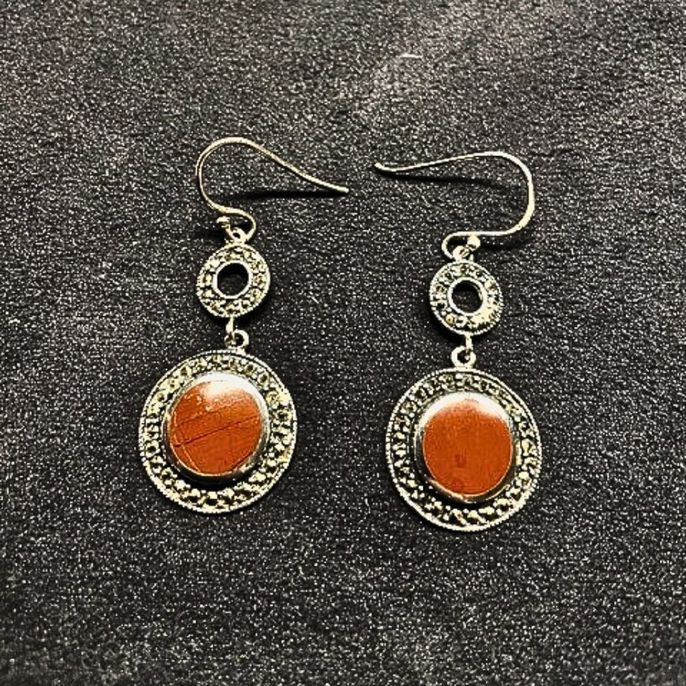 Beautiful Coral surrounded by 925 Silver and Hematite.